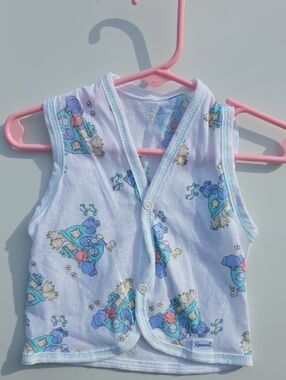 Spencer's White Baby Vest with Blue and Pink Cartoon Print